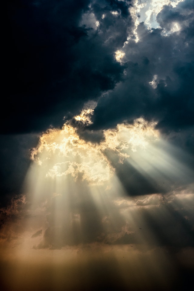 Rays of sunlight through clouds